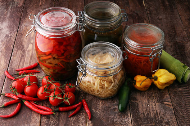 Jars with variety of pickled vegetables. preserved food.